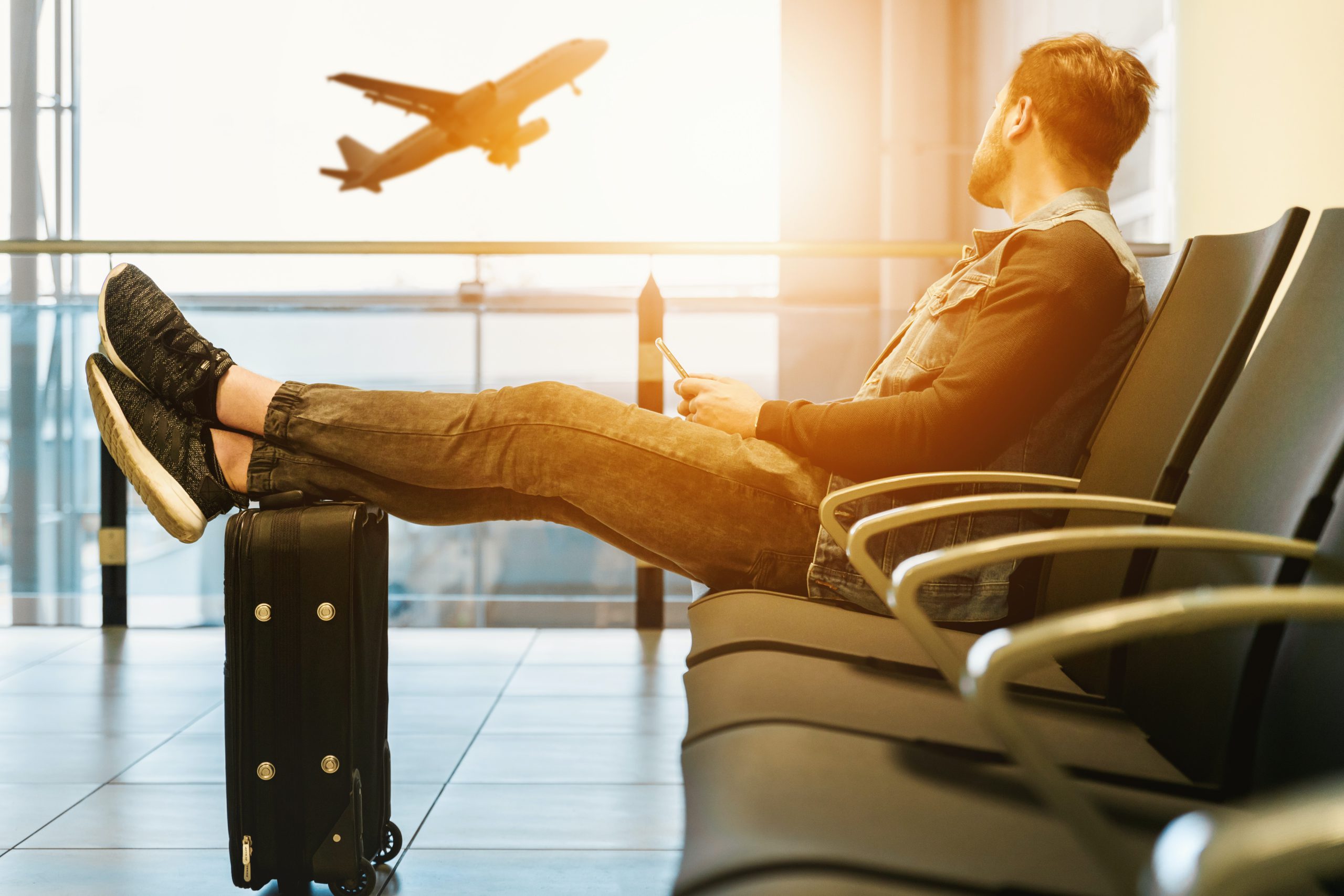 man, waiting, sitting, airport, boarding area, airplane